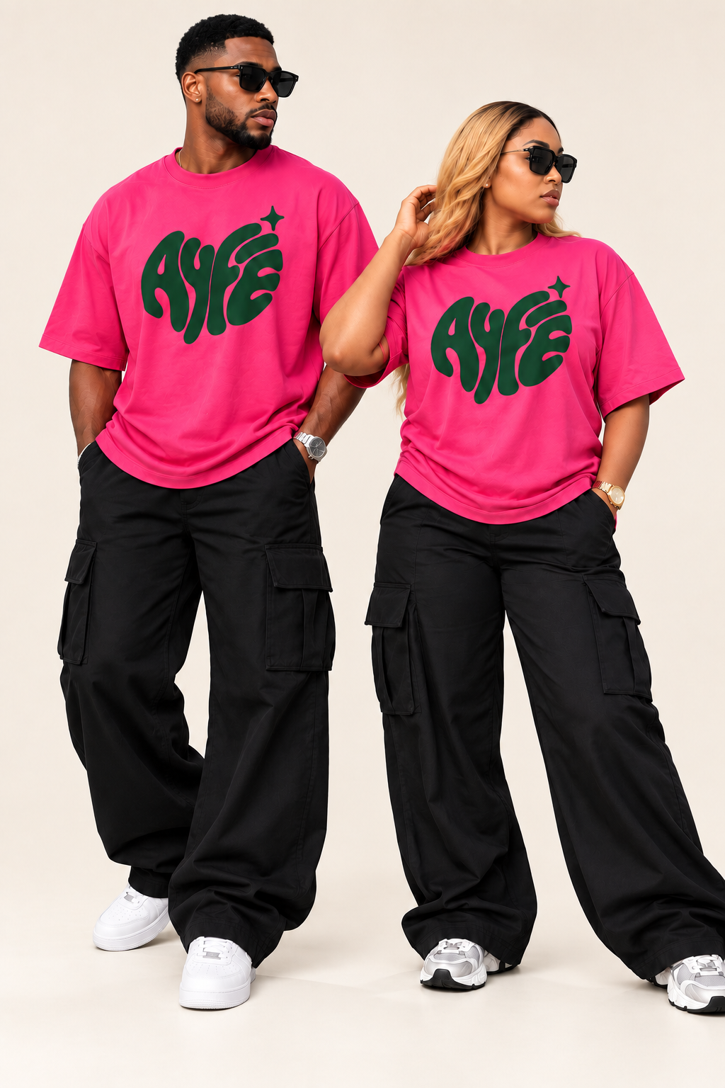 Two models wearing pink AYFE oversized tees